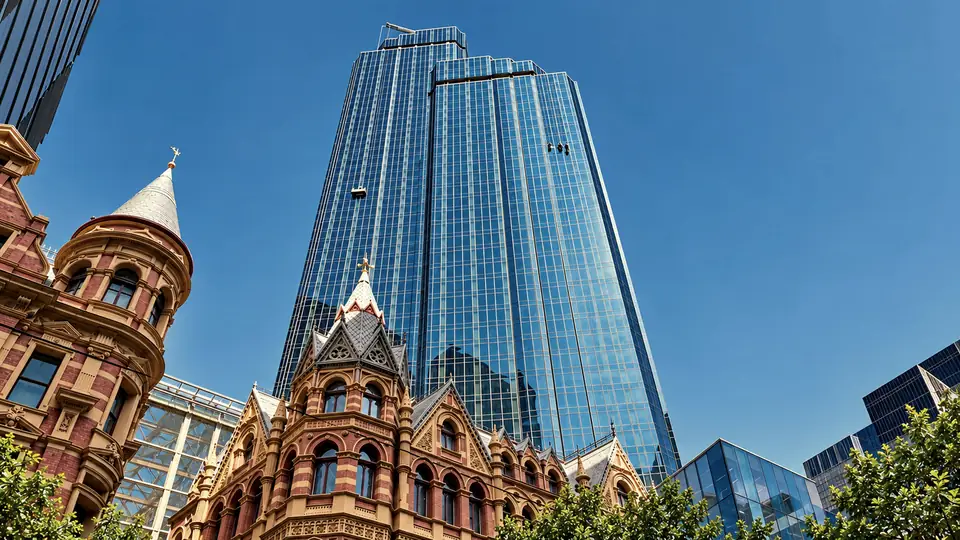 Rialto Towers above Collins Street with Tower Window Cleaning rope-access technicians and a BMU cradle working on the facade