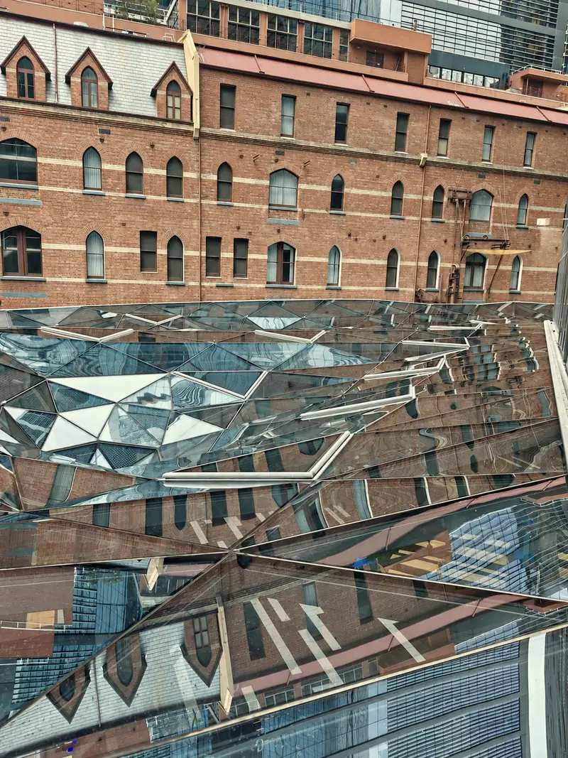The Rialto glass canopy reflecting the surrounding heritage brickwork